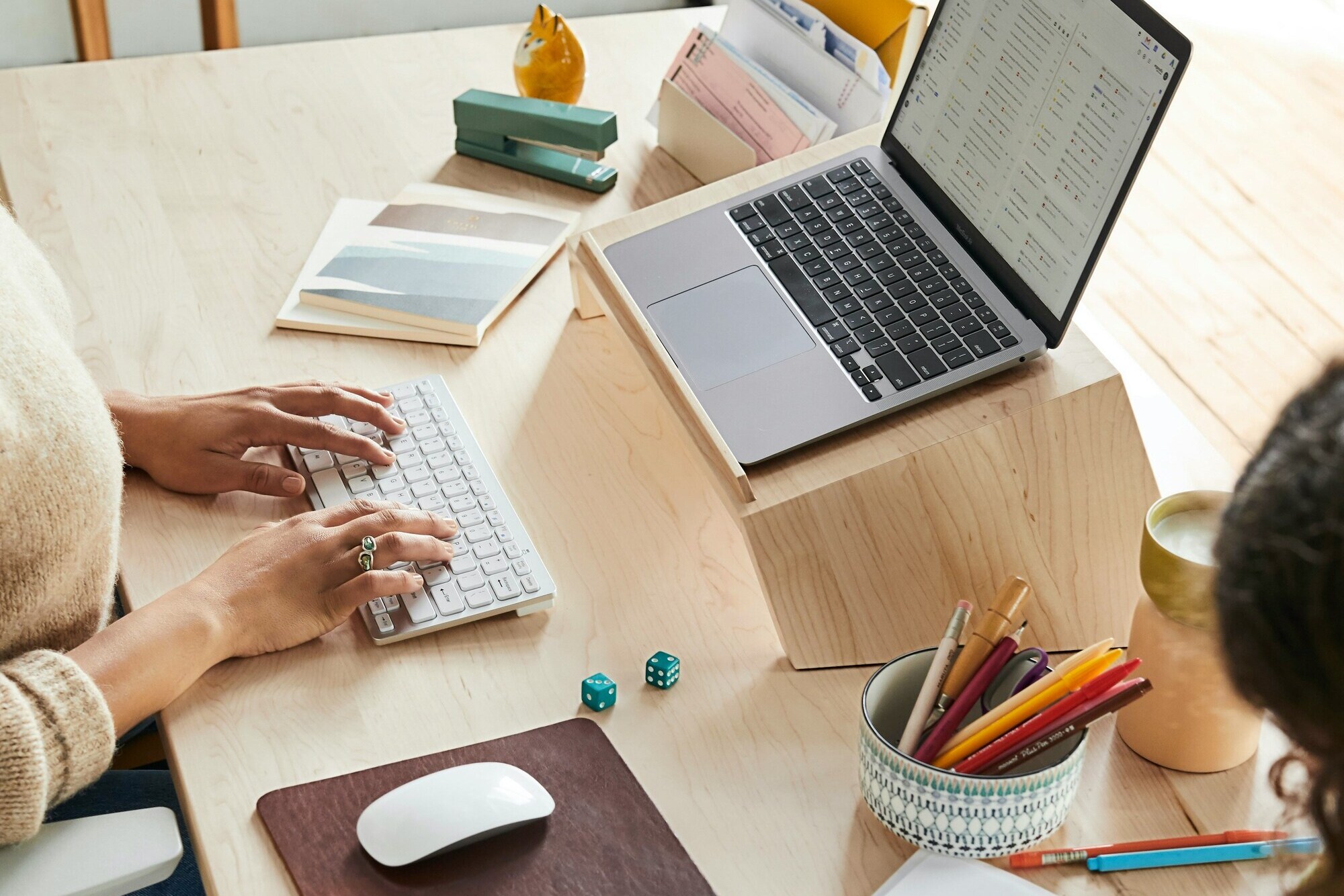 Desktop with laptop, mouse and other desk items